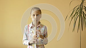 Little girl plays flute