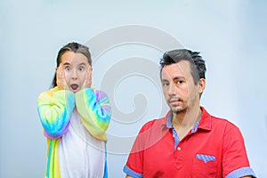 Little girl plays with her father at home in a beauty salon, combing her hair