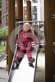 Little girl plays on the playgroun