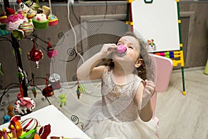 Little girl plays tea party at children`s party