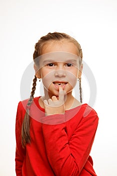 Little girl point by finger her first missing milk tooth, white background