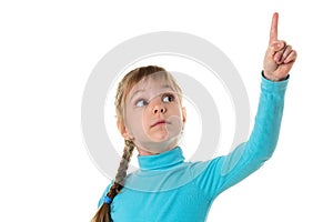 Little girl pointing her finger up, isolated on white landscape