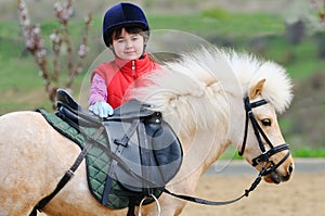 Little girl and pony