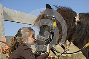 Little girl and pony