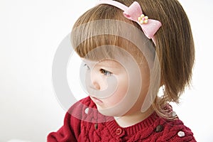 Little girl portrait. cute Caucasian baby bob hairstyle with rim