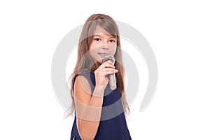 Little girl posing with a microphone for singing on white background.