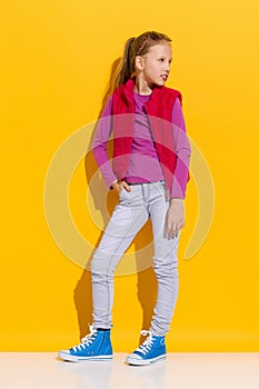 Little girl posing in sneakers