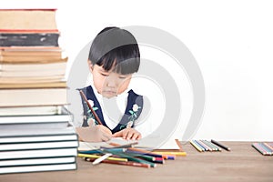 Little girl practicing writing in class