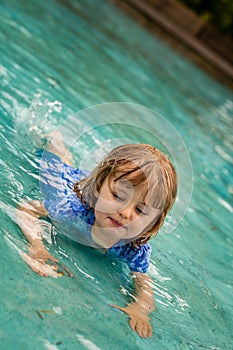 Little girl in a public pool for kids