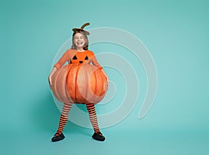 Little girl in pumpkin costume