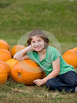 Little Girl in a Pumpkin Patch