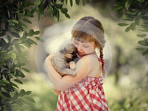 Little girl with a puppy