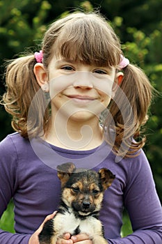 Little girl and puppy portrait