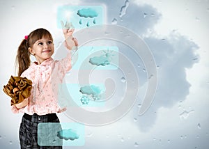 Little girl pushing on weather button