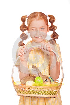 Little girl with a rabbit in basket easter eggs