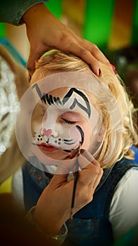Little girl rabbit face painting for Easter party