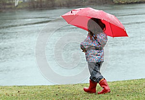 Little girl in the rain