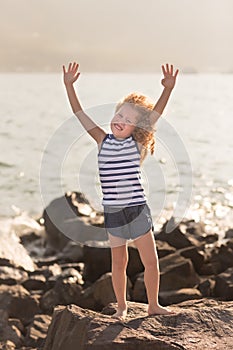 Little girl with raised hands