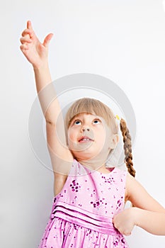 Little girl reaching for something with his hands.