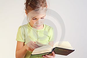 Little girl read bible