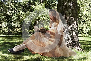 Little girl reading ancient book