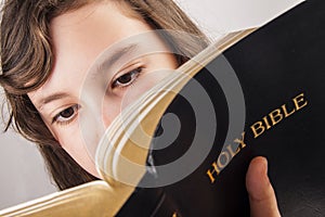 Little girl reading the bible