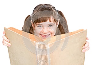 Little girl reading a big book. isolated on white background