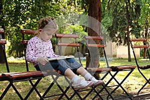 Little girl reading a book