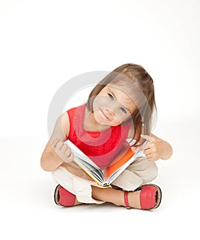 Little girl reading a book