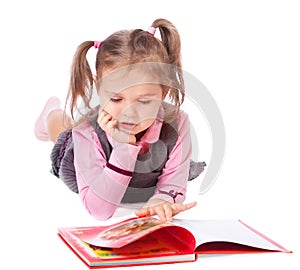 Little girl reading a book