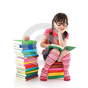 Little girl reading the book