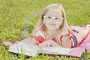 Little girl reading a book