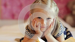 Little girl reading book