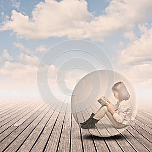 Little girl reading a book