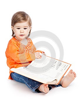 Little girl reading a book