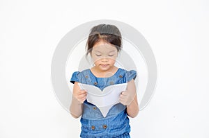 Little girl reading a book isolated