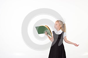 Little girl reading book, preparing for school