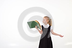 Little girl reading book, preparing for school