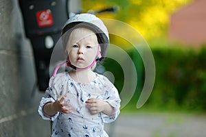 Little girl ready to ride a bicycle