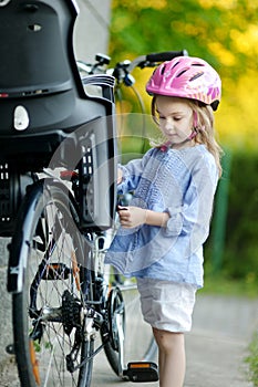 Little girl ready to ride a bicycle
