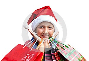 Little girl in red cap with shopping bags. Christmas