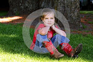 Little girl with red cowboy boots