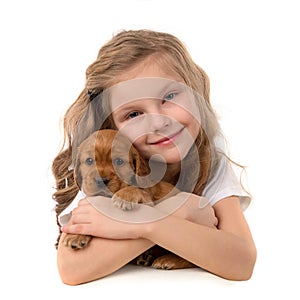 Little girl with red puppy isolated on white background. Kid Pet Friendship