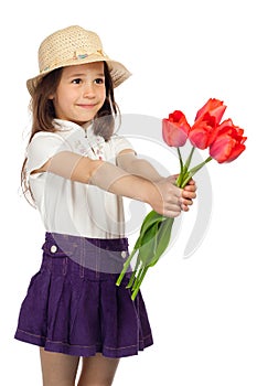 Little girl with red tulips