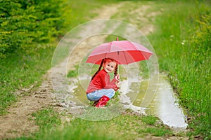 Little girl with red umbrella