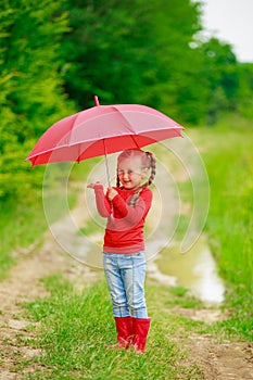 Little girl with red umbrella