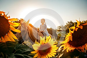 Little girl riding a horse