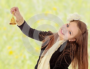 little girl rings the bell