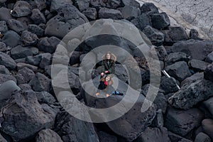 little girl on the rocks of the island of Stromboli