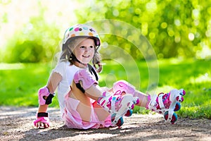 Little girl with roller skate shoes in a park